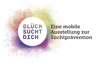 Bus mit bunter Farbe und der Aufschrift Glück sucht dich,